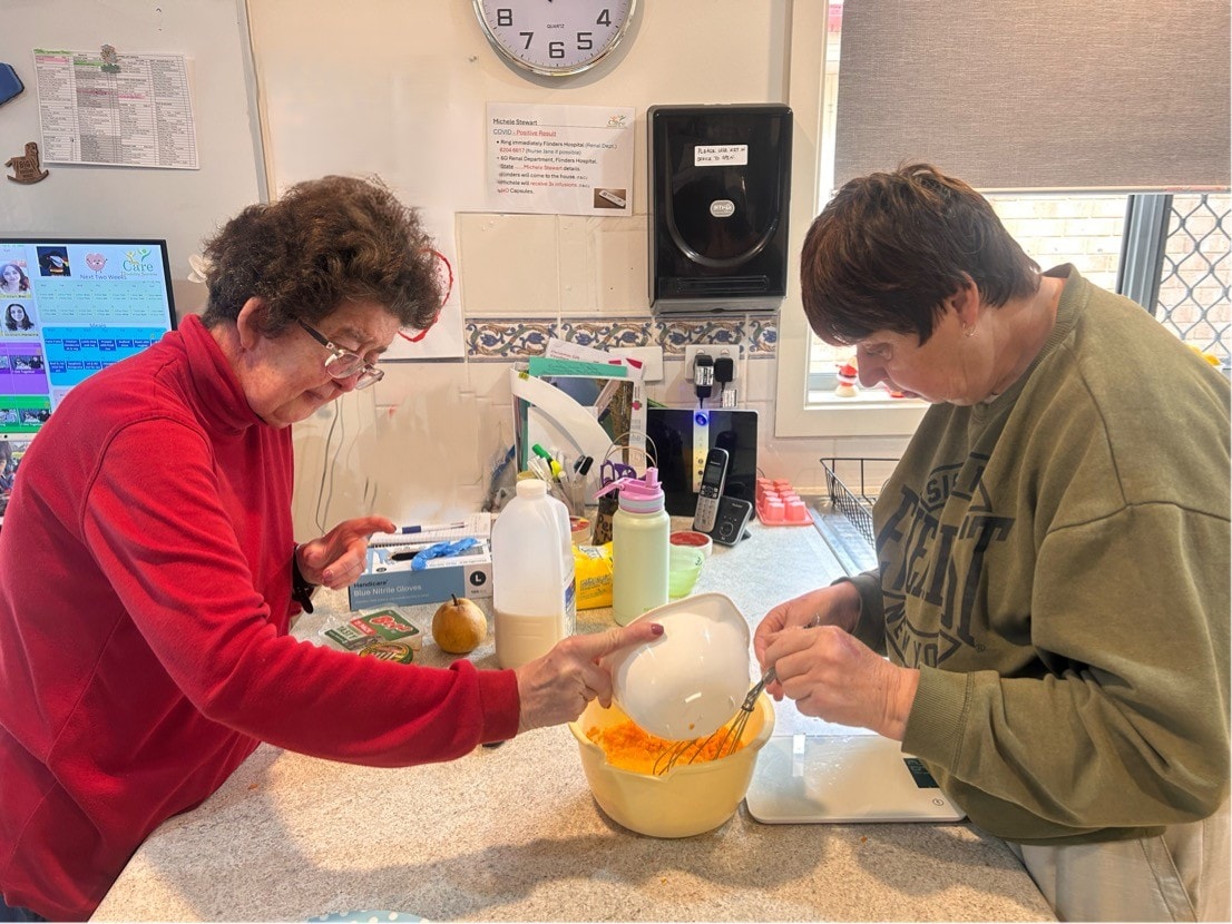 Two women doing a science experiment together